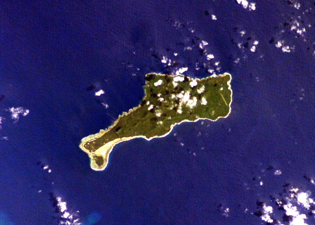 The elongated island of Motlav, also referred to as Mota Lava, lies in the northern Banks Islands of Vanuatu. The 12-km-long island is comprised of at least five Pleistocene basaltic stratovolcanoes capped by two well-preserved late-Pleistocene to Holocene pyroclastic cones, Tuntag and Vetnam. The low peak with a shadow above it at the lower left (SW) part of the island is Tuntog, a largely pyroclastic composite cone with a 500-m-wide summit crater. Vetnam pyroclastic cone lies in the center of the island. NASA International Space Station image ISS006-E-26739, 2003 (http://eol.jsc.nasa.gov/).