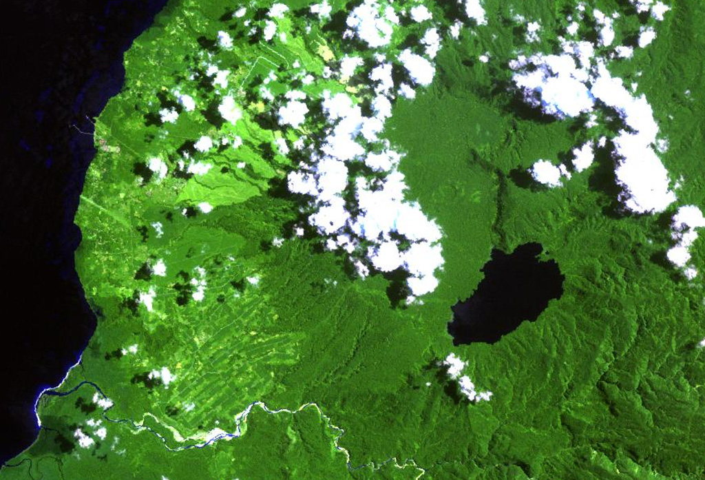 Lake Hargy (lower right) lies in the SE corner of the 10 x 12 km wide Hargy caldera. The Lobu River drains the lake through a notch in the northern caldera rim. The post-caldera cone of Galloseulo lies beneath the large cloud bank in the center of the image, about halfway from the lake to the Bismarck Sea. The Toiru River cuts across the bottom of the image. Small eruptions have taken place at Galloseulo over the past 7,000 years, the last occurring about 1,000 years ago. NASA Landsat image, 2000 (courtesy of Hawaii Synergy Project, Univ. of Hawaii Institute of Geophysics & Planetology).