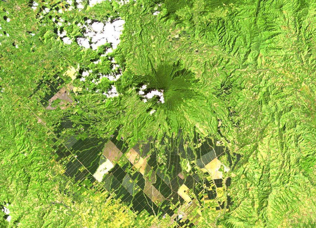 Matutum rises above farmlands in southern Mindanao. A well-preserved 320-m-wide and 120-m-deep crater has a densely forested floor. Widespread pyroclastic flow deposits surround the volcano.  NASA Landsat image, 2000 (courtesy of Hawaii Synergy Project, Univ. of Hawaii Institute of Geophysics & Planetology).