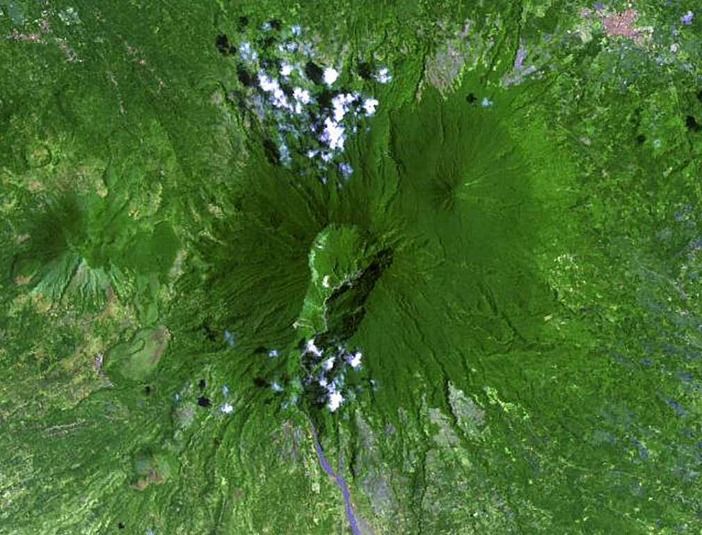 The large 2-km-wide, 600-m-deep crater that extends down the SSW flank of Banahaw contained a crater lake until 1730, when it drained, producing lahars.  The smaller San Cristóbal and Banáhao de Lucban have formed on the W and E flanks, respectively. Andesite-to-dacite lava domes formed on the flanks of Banahaw and San Cristobal. NASA Landsat image, 2002 (courtesy of Hawaii Synergy Project, Univ. of Hawaii Institute of Geophysics & Planetology).