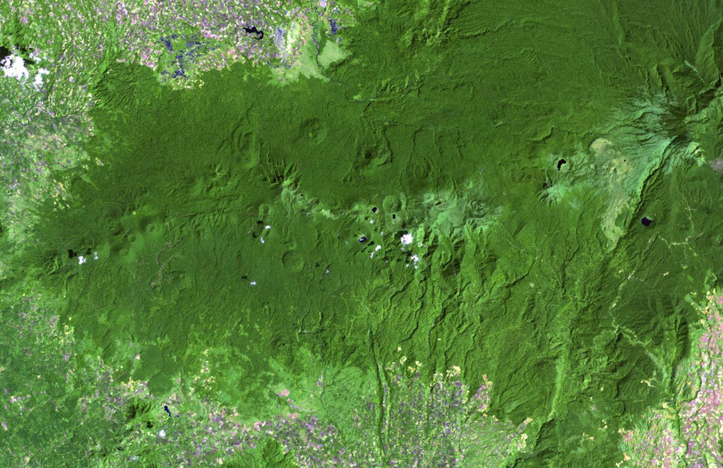 Poorly known Latukan volcano (right of center) lies in the middle of a chain of young E-W-trending volcanoes in NW Mindanao, SE of Lake Lanao (out of view to the upper left). Latukan is flanked on the west by Makaturing volcano (left-center) and closely on the east by the historically active Ragang volcano.  NASA Landsat image, 2003 (courtesy of Hawaii Synergy Project, Univ. of Hawaii Institute of Geophysics & Planetology).