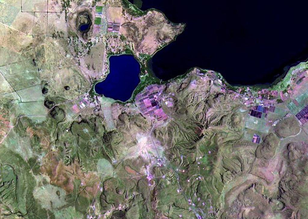 Vents of the northern part of the Olkaria volcanic complex are visible immediately S of Lake Naivasha (upper right). It comprises up to 80 individual rhyolitic centers, many of which are visible in this Landsat image. The youngest known eruption has a radiocarbon age of about 180 years. Fumarolic activity occurs at the Njorowa Gorge and at the Orengingnai and Orkaria (Olgaria) pumice cones. NASA Landsat image, 1999 (courtesy of Hawaii Synergy Project, Univ. of Hawaii Institute of Geophysics & Planetology).
