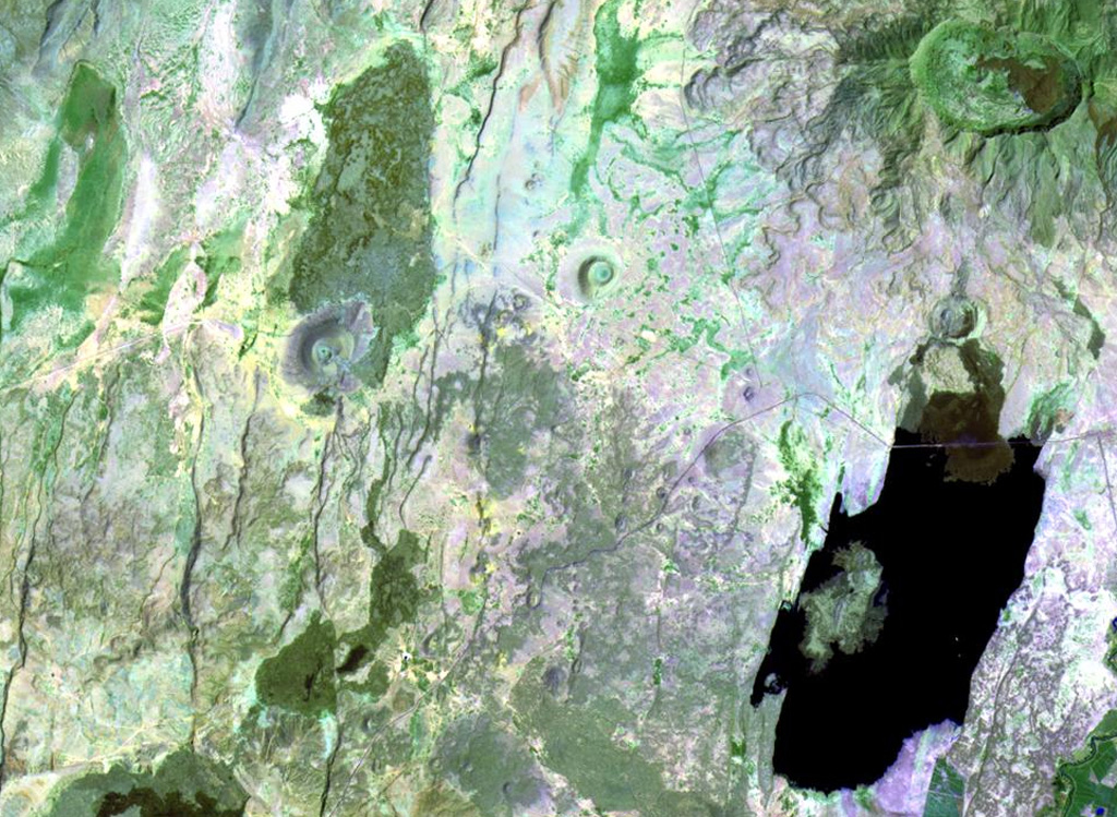 An area of Holocene basaltic cones and lava flows is located along the Main Ethiopian Rift at Beru, between Fentale (upper right) and Kone (Gariboldi) volcanoes (lower left). The lake at the lower right is Metahara, whose northern shore is formed by a young lava flow from a flank vent at Fentale. NASA Landsat image, 1999 (courtesy of Hawaii Synergy Project, Univ. of Hawaii Institute of Geophysics & Planetology).