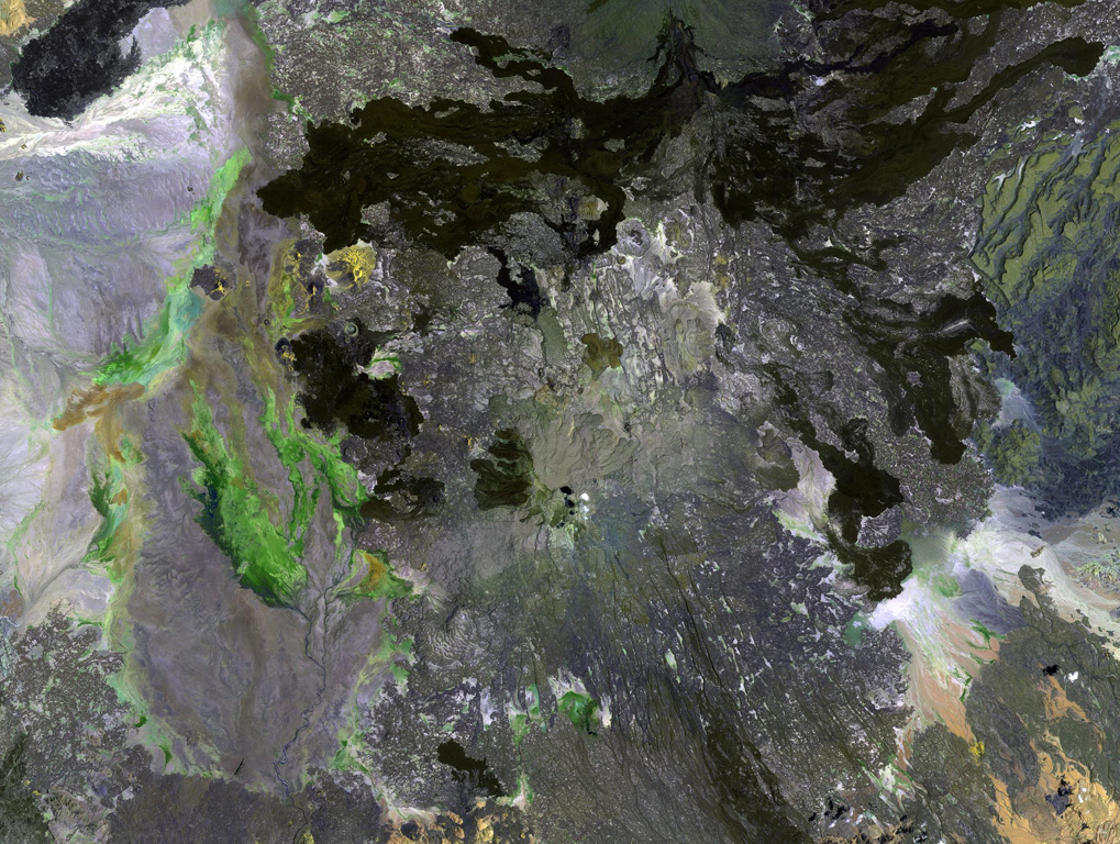 Dabbahu (also known as Boina or Moina) is a young volcanic massif (center) in the Afar depression SSW of the Alayta massif. Pantellerite obsidian flows, lava domes, and pumice cones form the summit and upper flanks of the volcano. Late-stage basaltic fissure eruptions occurred at the NW base of the volcano (upper left) and numerous fumaroles are located in the central part of the massif.  NASA Landsat image, 1999 (courtesy of Hawaii Synergy Project, Univ. of Hawaii Institute of Geophysics & Planetology).