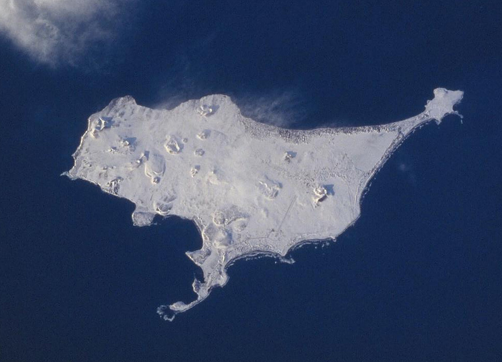 A Space Shuttle image of St. Paul Island shows Northeast Point to the upper right, Reef Point at the bottom-center, and Southwest Point to the left. Snow-covered Big Lake lies SW of Northeast Point, Bogoslof Hill near the center of the island, and Rush Hill is the cone along the NW coast. Rush Hill produced lava flows from NE-trending fissures. The 110 km2 island is the largest of the Pribilof Islands and contains more than a dozen scoria cones and associated lava flows. NASA Space Shuttle image STS099-728-21, 2000 (http://eol.jsc.nasa.gov/).