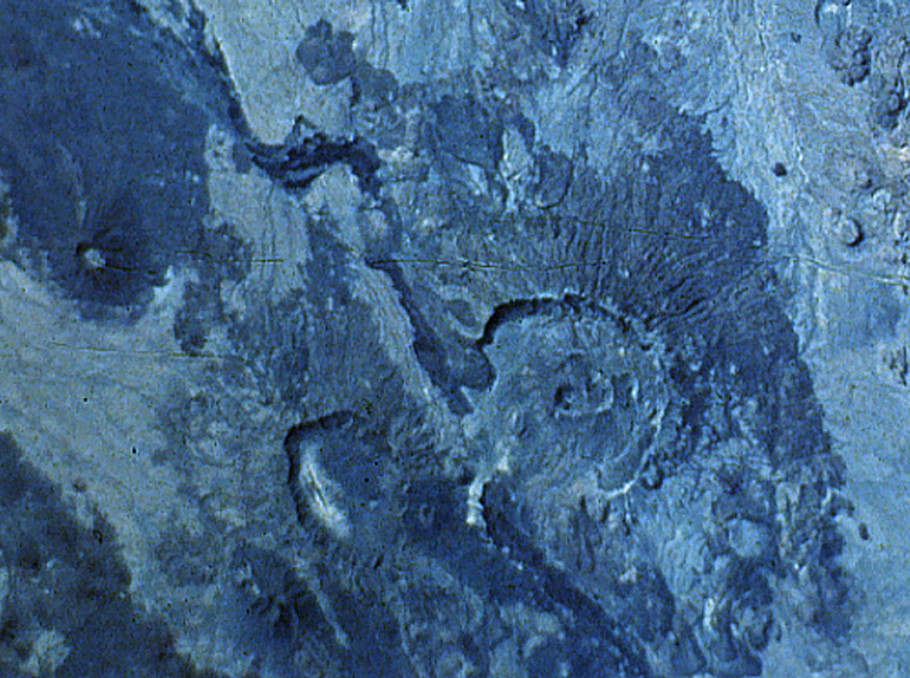 The smaller (left-hand) of the two large calderas at the bottom center of this NASA Space Shuttle image is Mallahle. The steep-walled 8-km-wide caldera truncates a stratovolcano. Basaltic lava flows blanket the slopes of the volcano, and flank vents are most numerous on its western side. Mallahle lies SW of the larger Nabro caldera (right-center) and is the central of three NE-SW-trending stratovolcanoes in the Danakil horst SW of Dubbi volcano. NASA Space Shuttle image S-61A-36, 1985 (http://eol.jsc.nasa.gov/).