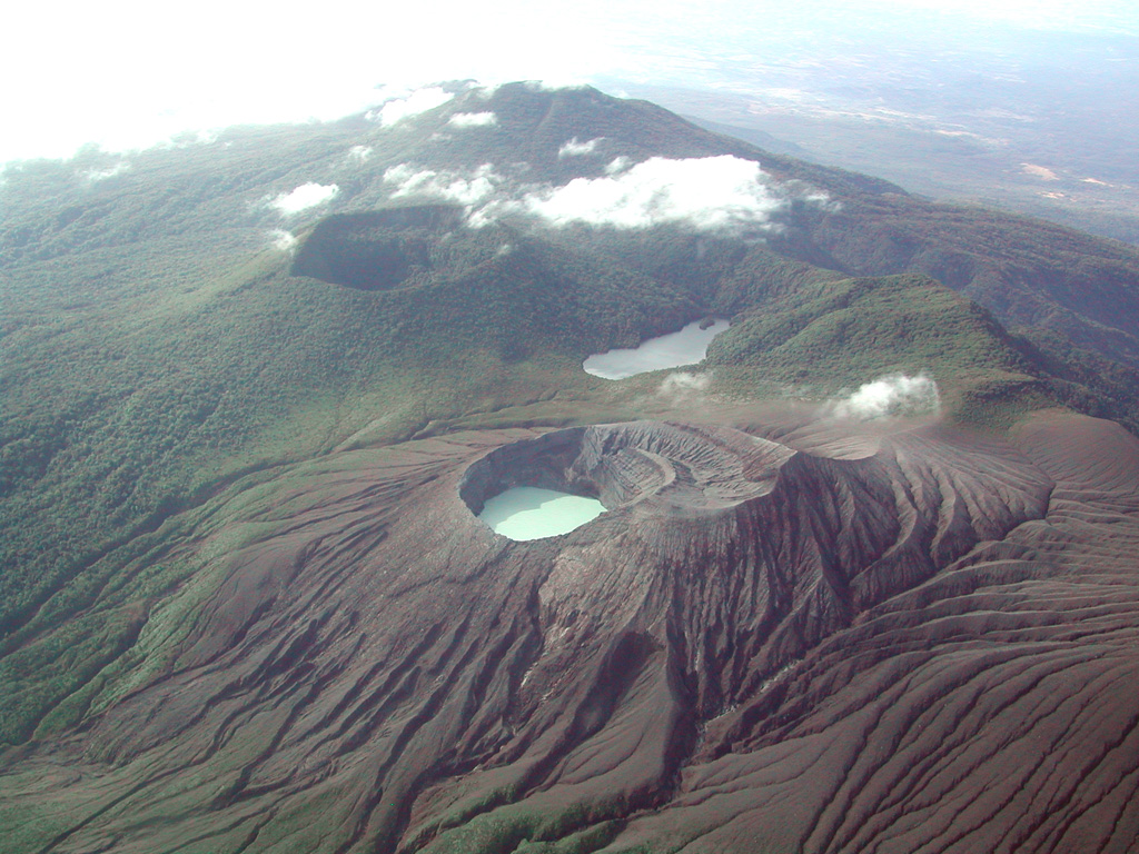 The flanks surrounding the Rincón de la Vieja Cráter Activo are shown in this aerial view from the NE. Los Jilgueros lake is in the middle and the large forested inactive crater behind it and to the left.  Photo by Eliecer Duarte (OVSICORI-UNA).