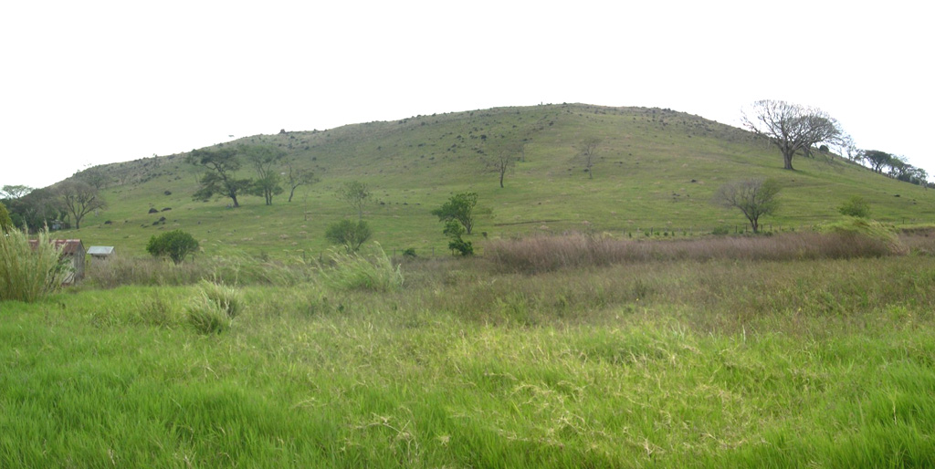 The low-angle, grass-covered eastern slopes of Cerro Tilarán (also known as Cerro Tovar) are seen from the SW part of the town of Tilirán.  The small 634-m-high andesitic shield volcano lies at the NW end of the Tilarán Range west of Lake Arenal.  The Tilarán shield is overlain only by tephra deposits from Arenal (maximum age about 7000 years), but has an Argon-Argon date of 1 million years. Photo by Eliecer Duarte (OVSICORI-UNA).