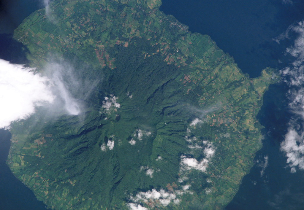 Maderas volcano, seen in this NASA International Space Station image with north to the upper right, forms the southeastern part of the dumbbell-shaped island of Ometepe.  The roughly conical stratovolcano is cut by numerous faults and grabens, the largest of which is oriented NW-SE.  The small Laguna de Maderas lake occupying summit crater is visible left of the center of this image.  The satellitic Gorda pyroclastic cone forms the narrow peninsula at the right. NASA International Space Station image ISS005-E-17746, 2002 (http://eol.jsc.nasa.gov/).