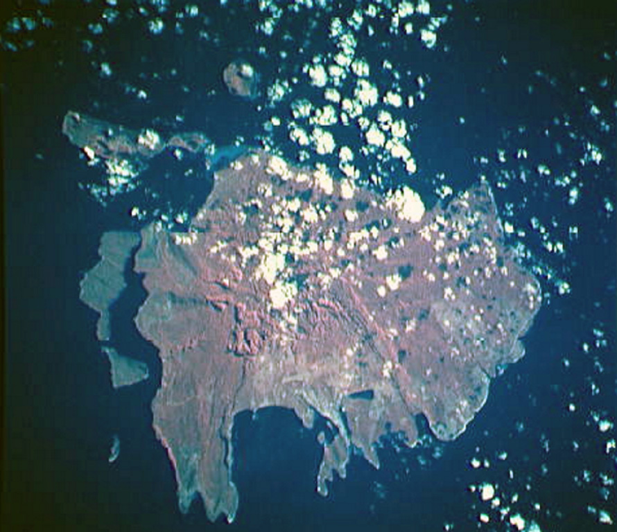 The three small islands of Nguna, Pele, and Emau at the upper left, are located N of the large island of Efete (also known as Vate). Nguna and Pele appear to be a single island in this NASA Space Shuttle image (N is to the upper left), and Emau is the small circular island at the at the top center. These islands are thought to lie along or near the southern rim of a largely-submarine caldera of uncertain dimensions that extends to the N and may have formed about 2,000 years ago. NASA Space Shuttle image STS068-206-50, 1994 (http://eol.jsc.nasa.gov/).
