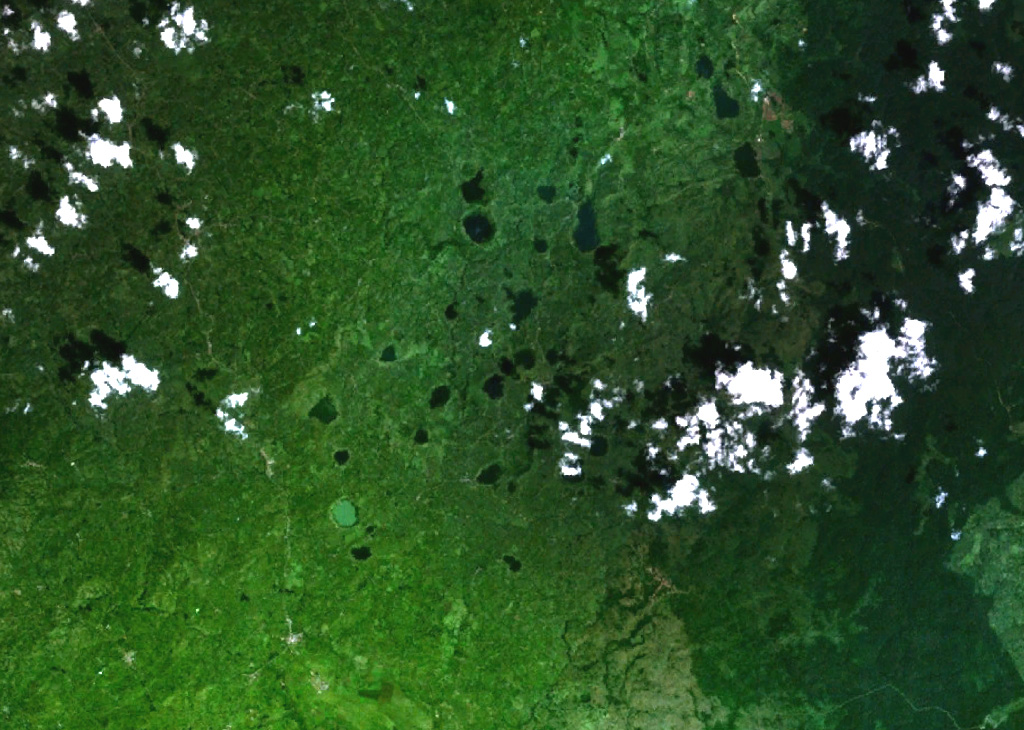 Mostly lake-filled maars and tuff cones dot the center of this NASA Landsat image (with N to the top) of the Kyatwa volcanic field. The Kyatwa vents, also known as the Ndale volcanic field, occupy the Western Rift Valley, east of the Ruwenzori Mountains halfway between Lake Edward and Lake Albert. The Kyatwa tuff cones are part of a group of Pleistocene-to-recent volcanic fields in western Uganda. NASA Landsat 7 image (worldwind.arc.nasa.gov)