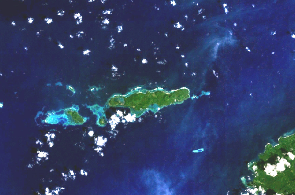 A cluster of basaltic volcanoes forms the Mundua Islands, N of New Britain. The largest volcanic center is formed by the western tip of the 7-km-wide Mundua Island and the arcuate Wingoru Island immediately to the west. The crater is flooded by the sea through narrow channels on the N and S sides. Small cones can be seen on the E side of Mundua. The W tip of Garove Island is visible at the lower right in this NASA Landsat image. NASA Landsat 7 image (worldwind.arc.nasa.gov)