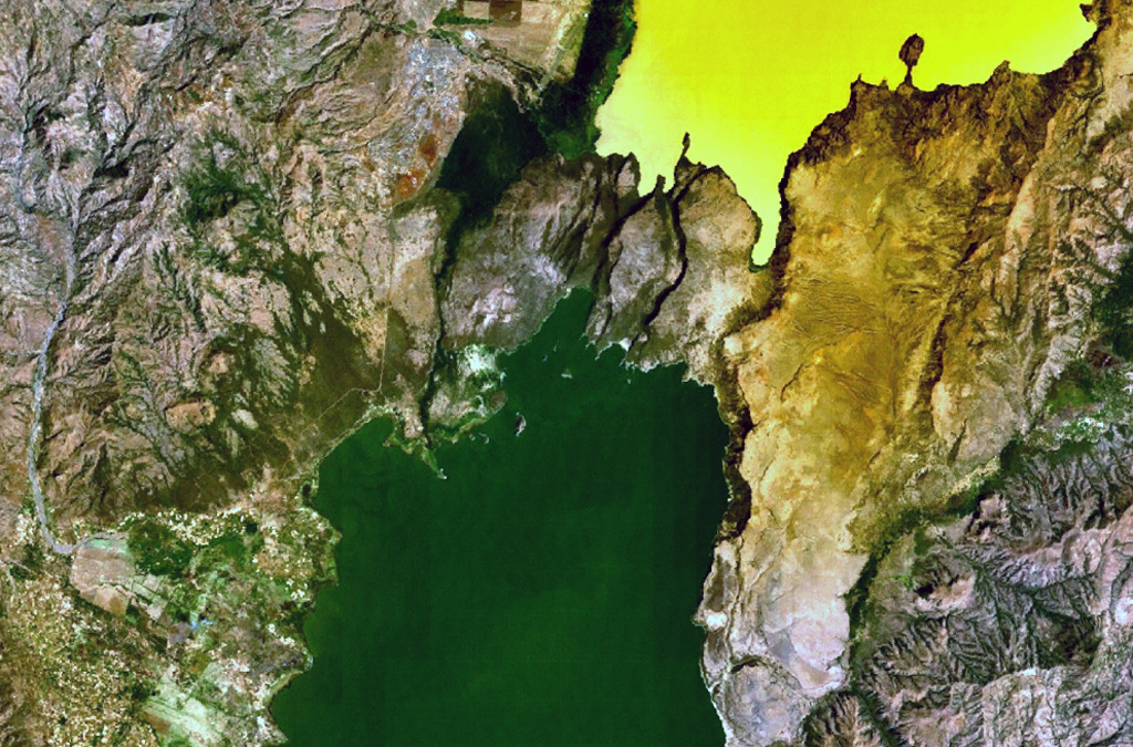 A group of scoria cones and basaltic lava flows at Tosa Sucha lies near the northern shore of Lake Chamo, the greenish lake at the bottom-center portion of this NASA Landsat image (with north to the top). The cones occupy a faulted area between Lake Chamo and the southern end of yellowish Lake Abaya. Some cones form islands in Lake Chamo.  NASA Landsat 7 image (worldwind.arc.nasa.gov)