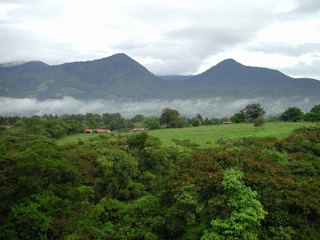 Volcán Platanar rises above farmlands to the north. The summit is also known as Cerro Congo after the howler monkeys occupying its slopes. It lies about 8 km SE of the city of Quesada at the northern end of the Palmira-Chocosuela-Platanar volcanic complex.  Photo by Eliecer Duarte (OVSICORI-UNA).