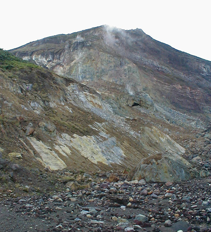 Hydrothermally altered rocks and lava flows are exposed in cliffs on the Irazú upper northern flank. Las Fumaroles (near top center), a thermal area below the cliffs, was the source of an explosive eruption in December 1994 that also produced an avalanche and lahar down the Río Sucio. Photo by Eliecer Duarte, 2001 (OVSICORI-UNA).