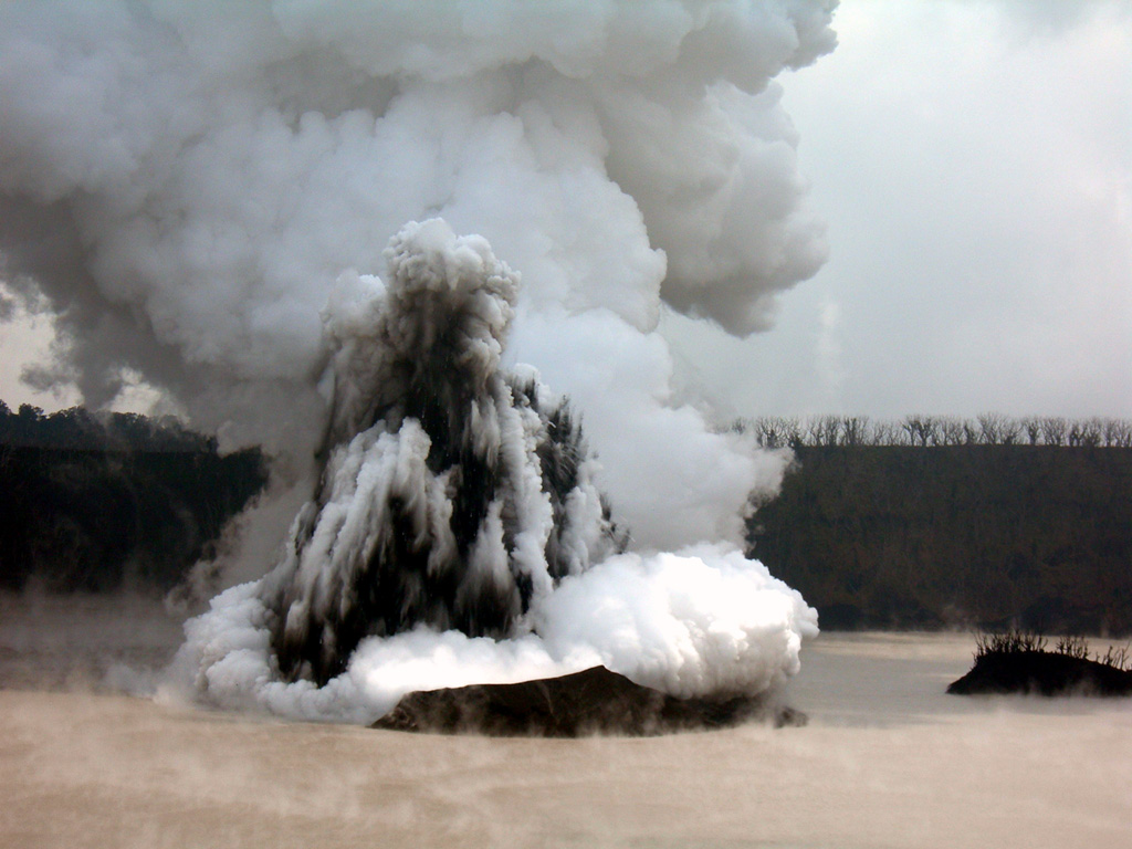 A telephoto view looking approximately E from the crater rim on 4 December 2005 shows a Surtseyan eruption from Lake Voui, on Ambae volcano. This explosive eruption began in Lake Voui on 27 November and resulted in the formation of a new cone in the lake. Photo by Philipson Bani, 2005 (Institut Recherche Développement, IRD).