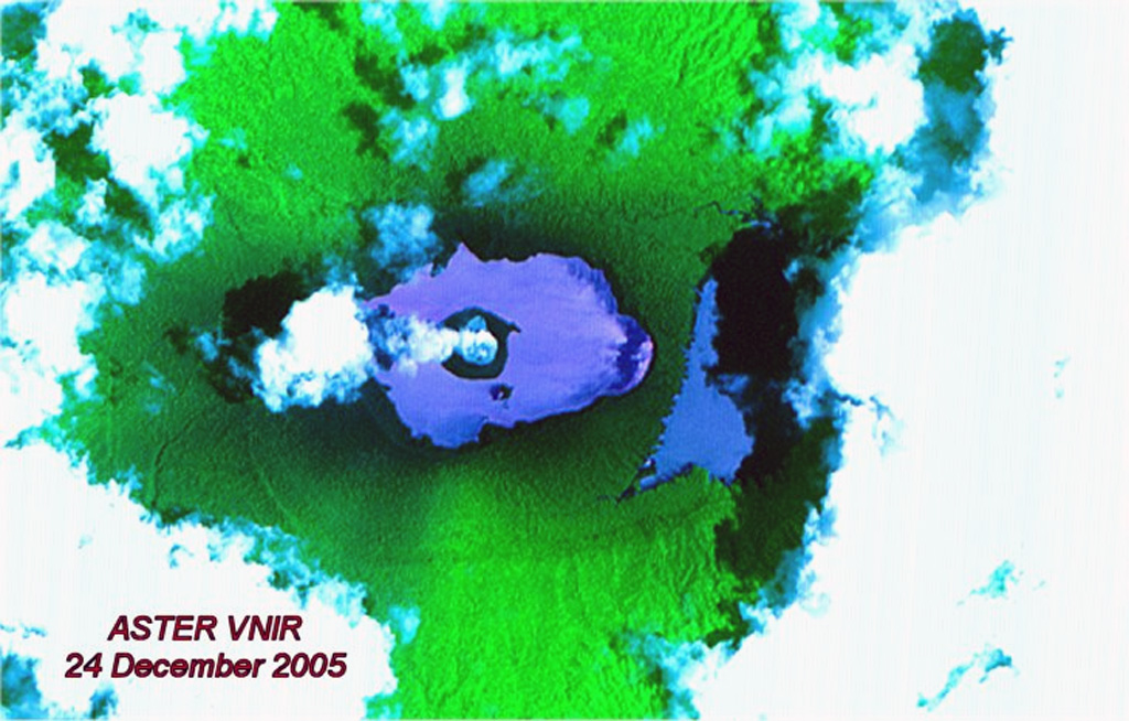 An ASTER false-color satellite image of Ambae taken on 24 December 2005 shows a plume from Lake Voui above a new island that formed during an eruption that began on 27 November. The eruption built the new island with its own crater lake near the center of Lake Voui; this island has a mean diameter at this time of 525 m. Lake Manaro Lakua at the right sits within the eastern end of the caldera and is partly obscured by cloud and shadow. NASA ASTER image, 2005 (courtesy of Alain Bernard, Université Libre de Bruxelles).