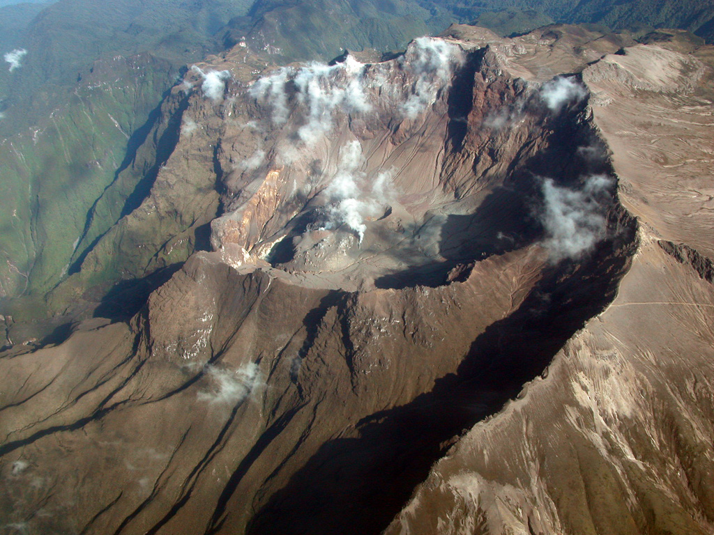 A large breached caldera formed by edifice collapse during the Pleistocene truncates the summit of 4784-m-high Guagua Pichincha volcano, which overlooks Ecuador's capital city, Quito.  A lava dome was constructed within the active crater at the head of the collapse scarp. Photo by Patricio Ramon, 2003 (Escuela Politécnica Nacional, Quito).