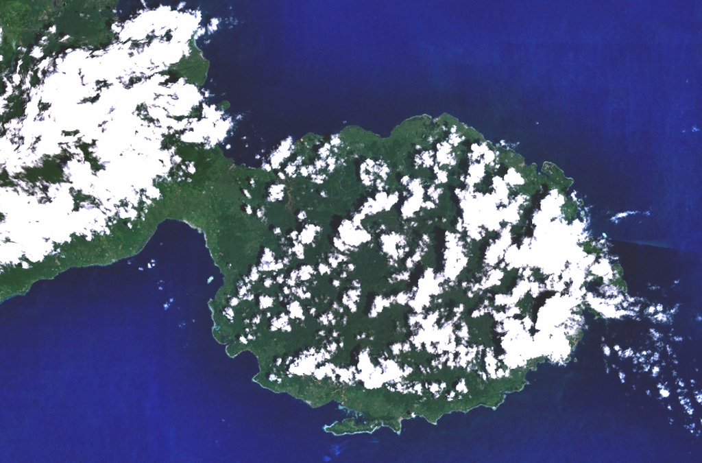 The peninsula in the center of this NASA Landsat image (with north to the top) forms the SE tip of Bacan Island, west of the southern tip of Halmahera.  Bukit Bibinoi (Bibinoi Hill) is the largest and SE-most of a group of three andesitic Holocene stratovolcanoes located along a NW-SE line on the peninsula.  The smaller Songsu and Lansa volcanoes straddle a narrow isthmus (left center) separating the peninsula from the Sibela Mountains metamorphic complex to the NW.  NASA Landsat 7 image (worldwind.arc.nasa.gov)