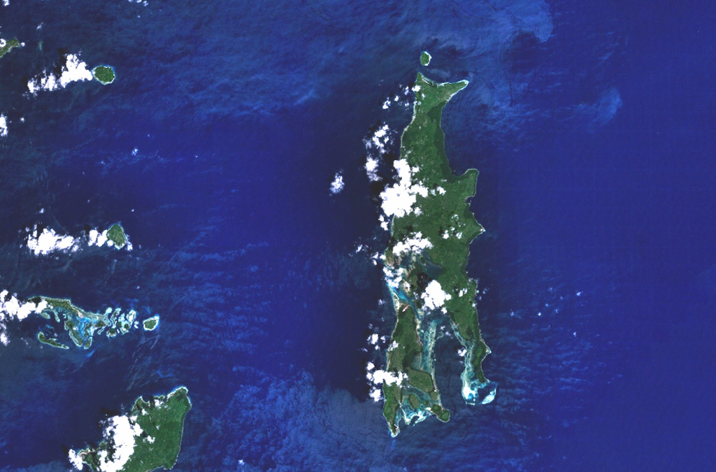 Gunung Tigalalu is located at the northern end of elongated Kayoa Island (center), which straddles the equator and is the southernmost of a chain of small volcanic islands off the western coast of Halmahera Island (out of view to the right).  North is to the top in this NASA Landsat image.  Tigalalu forms a N-S-trending volcanic ridge at the north end of the island, part of which is flanked by coral limestones.   NASA Landsat 7 image (worldwind.arc.nasa.gov)