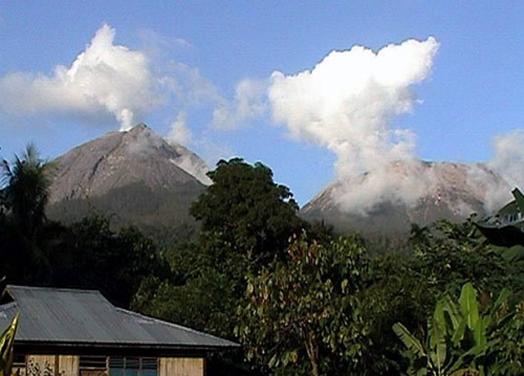 Lewotobi Lakilaki (left) and Lewotobi Perempuan (right) rise above forests on their western flanks. They were constructed along a NW-SE-trending line. Both volcanoes have erupted during historical time but Lakilaki has been more active. Photo by Joël Boyer, 2004 (L.A.V.E.)