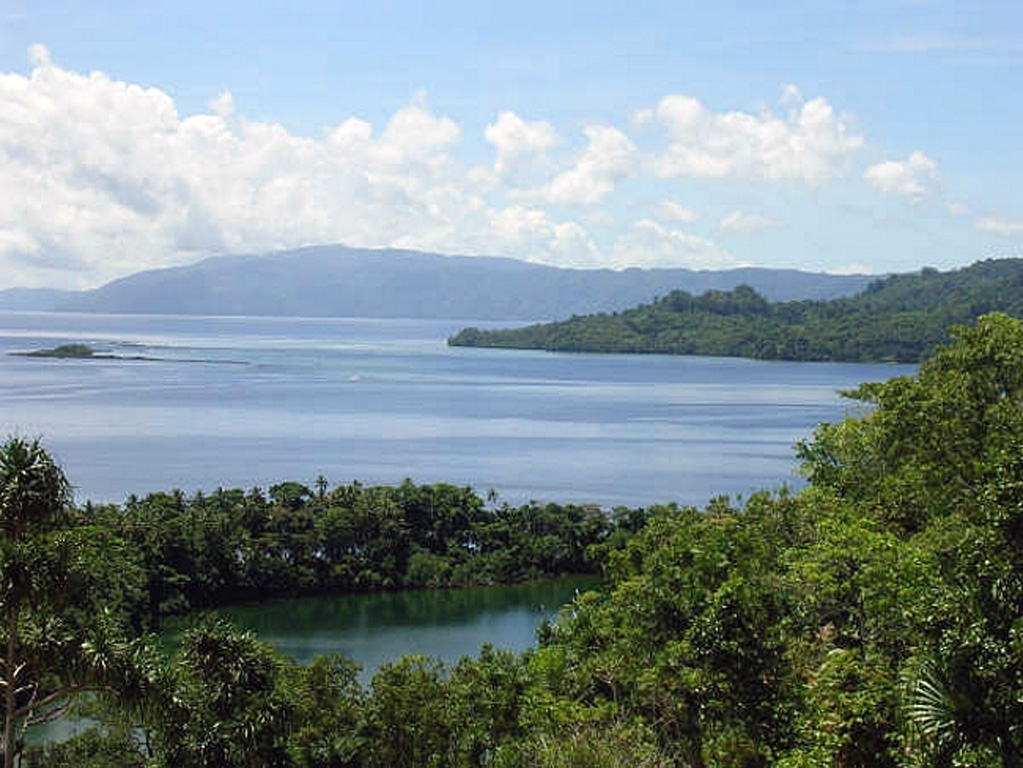 The saltwater Lake Ove in the foreground is seen from the rim of Ngusunu crater with the W coast of Simbo Island in the background. Simbo is a small island in the western Solomon Islands with three truncated andesitic volcanic centers. Indigenous people’s accounts told of the explosive enlargement of the Ngusunu explosion crater along the SW coast of the island one to two generations prior to 1955 and probably after 1882. Press reports mentioned an eruption at Simbo in the early 1900s. Photo by Chris Lyne, 2005.