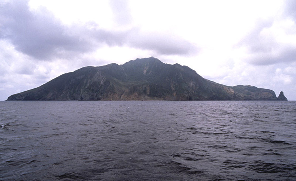 Gaja-jima volcano, which lies east of the main arc Ryukyu arc, is located WNW of Nakano-shima.  Gaja-jima is seen here from the NE with a collapse scarp in the center of the image below the summit.  The andesitic stratovolcano reaches 497 m above sea level.  Kogaja-jima (Little Gaja Island) lies ESE of Gaja-jima. Copyrighted photo by Shun Nakano, 2005 (Japanese Quaternary Volcanoes database, RIODB, http://riodb02.ibase.aist.go.jp/strata/VOL_JP/EN/index.htm and Geol Surv Japan, AIST, http://www.gsj.jp/).