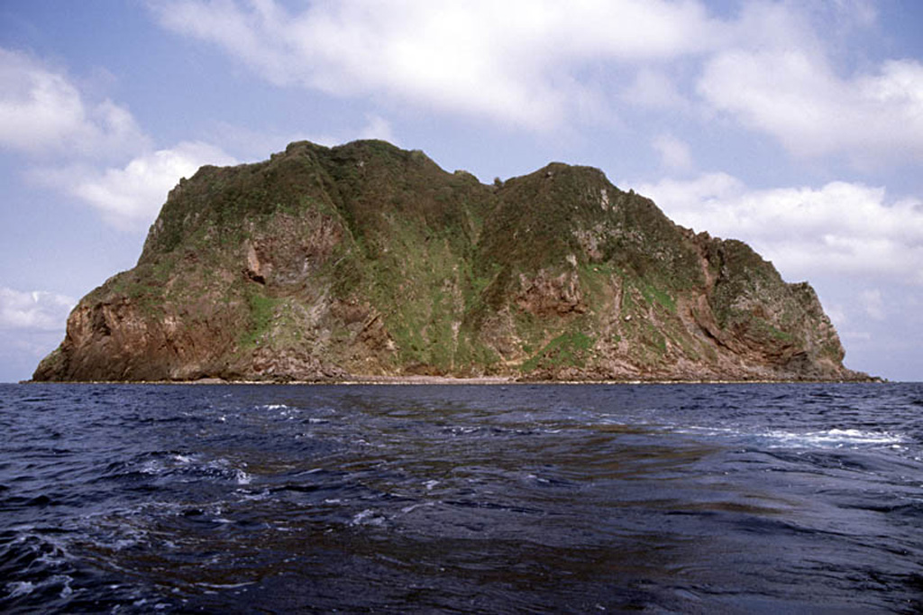 The steep cliffs of Kogajajima, a small volcanic island located NW of Nakanoshima, are seen here from the WSW. The lava domes were considered to be of late-Pleistocene to Holocene age and there is minor fumarolic activity exposed in the cliffs. Kogajajima (Little Gaja Island) lies ESE of the larger Gajajima.  Copyrighted photo by Shun Nakano, 2005 (Japanese Quaternary Volcanoes database, RIODB, http://riodb02.ibase.aist.go.jp/strata/VOL_JP/EN/index.htm and Geol Surv Japan, AIST, http://www.gsj.jp/).