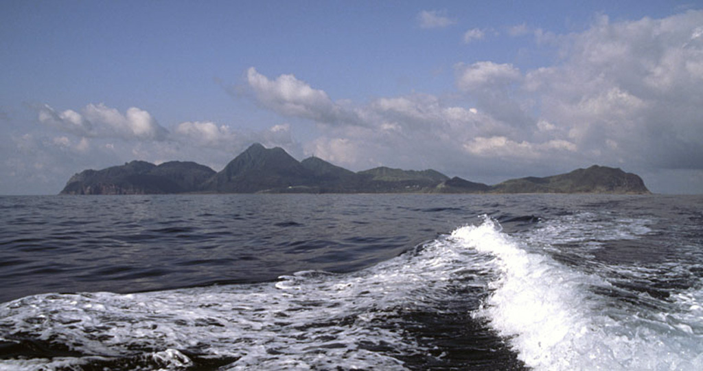 Kuchinoshima consists of two cones and a NW-SE-trending chain of lava domes, seen here from the NE. Two small villages, Nishinohama and Kuchinoshima, lie at the northern end of the island. The Maedake lava dome (left-center) forms the highest point on the 3 x 7 km island. Copyrighted photo by Shun Nakano, 2005 (Japanese Quaternary Volcanoes database, RIODB, http://riodb02.ibase.aist.go.jp/strata/VOL_JP/EN/index.htm and Geol Surv Japan, AIST, http://www.gsj.jp/).