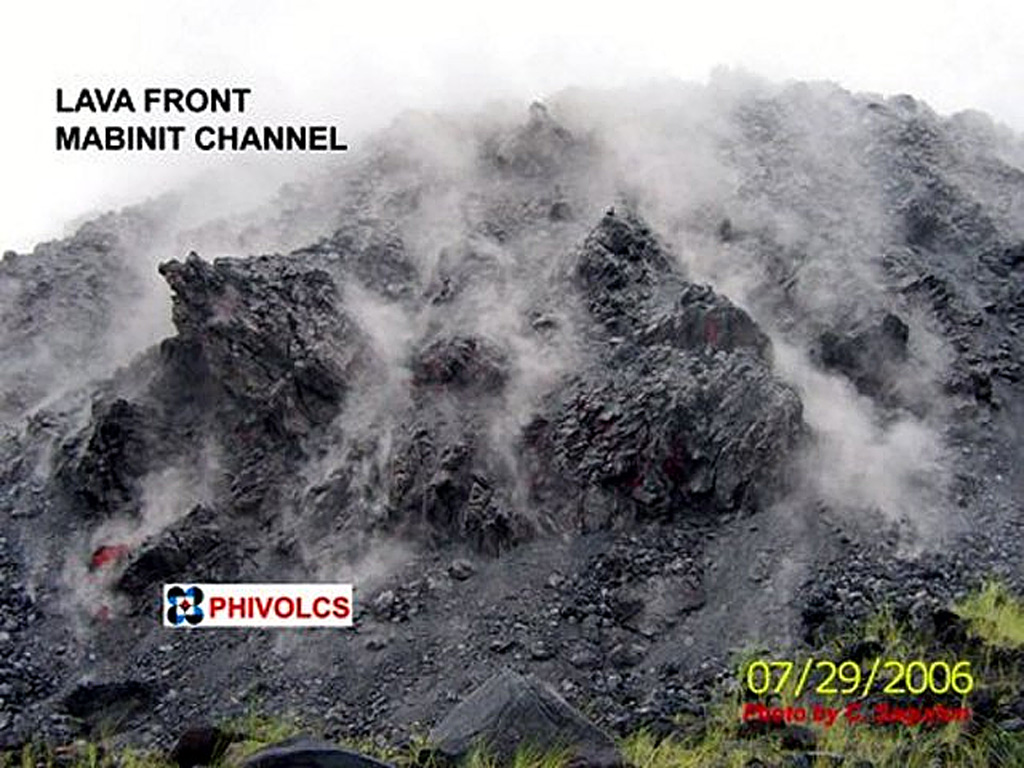 A lava flow front at Mayon is seen here on 29 July 2006 as it continued to advance down the Mabinit channel. Phreatic eruptions had begun on 13 July and lava extrusion was noted the following day, eventually reaching over 6 km to the SSE. Intermittent explosions continued and lava effusion ceased on 1 October. Pyroclastic flows occurred on 20 July and 12 August.  Photo courtesy of C. Sagution, 2006 (PHIVOLCS).