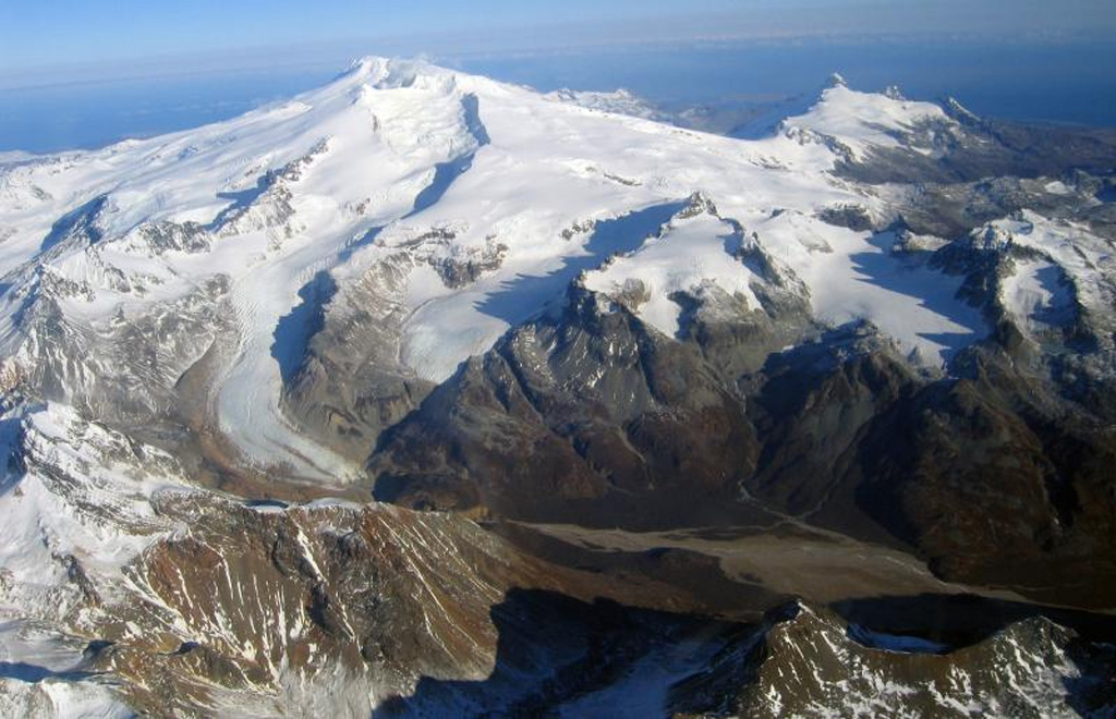 Glaciated Fourpeaked volcano in NE Katmai National Park is seen here from the south with the Swikshak River in the foreground. Holocene eruptions at Fourpeaked had not been confirmed prior to its first recorded eruption in September 2006. Photo by Jennifer Adleman, 2006 (U S Geological Survey, Alaska Volcano Observatory).