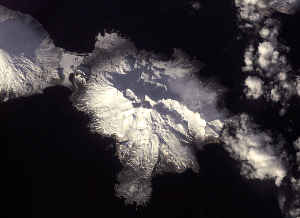 The Tana volcanic complex in the center of this NASA International Space Station image forms the eastern half of Chuginadak Island, across from Cleveland visible to the upper left. A young cone and crater form the western summit. NASA International Space Station image ISS001-E-5957, 2001 (http://eol.jsc.nasa.gov/).