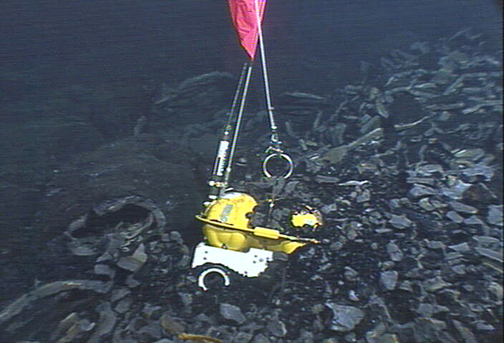 An eruption in 2005-2006 that covered 23 km2 of sea floor with lava at the East Pacific Rise encased three ocean-bottom seismometers. Scientists successfully recovered two seismometers that were deployed in 2003 with the remotely operated vehicle Jason during a National Science Foundation/Woods Hole Oceanographic Institution expedition in April 2007. Photo courtesy National Deep Submergence Facility, ROV Jason, Woods Hole Oceanographic Institution and National Science Foundation.