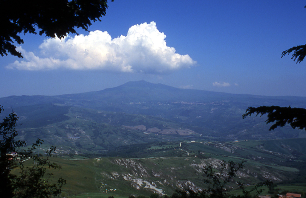 Monte Amiata seen from near Radicofani, E of the volcano. The late-Pleistocene lava dome complex is located about 20 km NW of Lake Bolsena in the southern Tuscany region of Italy. The complex formed during two major eruptive episodes about 300,000 and 200,000 years ago. No eruptive activity has occurred during the Holocene, but thermal activity resulting in cinnabar mineralization continues at a producing geothermal field near the town of Bagnore. Photo by Anita Cadoux, 2002 (Instituto de Geofísica, UNAM, Mexico).