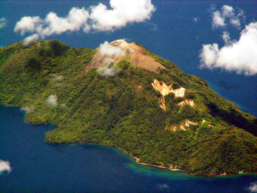 The small, 2 x 4 km island of Serua, seen here from the north, is elongated in a NE-SW direction.  An unvegetated lava dome forms the summit of the volcano, which rises 3600 m above the Banda Sea floor.  The 641-m-high truncated central cone is surrounded by an old somma wall.  Serua, also known as Legatala, is one of the most active of the Banda Sea volcanoes, with many eruptions recorded since the 17th century.   Copyrighted photo by Michael Thirnbeck, 2007.