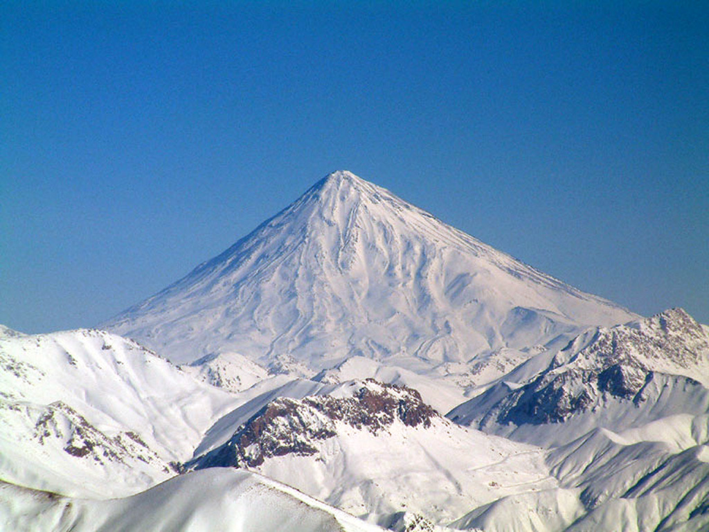 Activity at snow-capped Damavand volcano, 70 km NE of Iran's capital city of Tehran, has been dominated by lava effusion and recent lava flows erupted from the summit vent to the W. The youngest dated lava flows were erupted about 7,000 years ago. No historical eruptions are known, but hot springs are located on the flanks and fumaroles are found at the summit crater. Photo by Arad Mojtahedi, 2006 (http://en.wikipedia.org/wiki/Image:Damavand_in_winter.jpg).