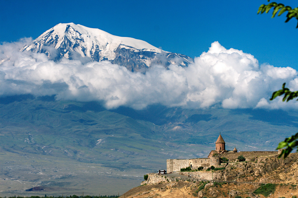 Snow-capped Mount Ararat is seen from the Khor Virap monastery in Armenia, NE of the volcano. Ararat, also known as Agri Dagi, is Turkey's highest and easternmost volcano, lying near the border with Armenia. Ararat appears to have been active during the 3rd millennium BCE; pyroclastic flow deposits overlie early Bronze Age artifacts and human remains.  Photo by Andrew Behesnilian (Wikimedia Commons).