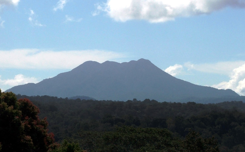 Sumbing volcano in Kerinci-Seblat National Park is seen here from the east. Sumatra's Sumbing volcano has a complicated summit region containing several crater remnants and a 180-m-long crater lake. Its two known historical eruptions, in 1909 and 1921, produced moderate explosions. Hot springs occur at the SW foot of the volcano. Photo by Deb Martyr (Fauna & Flora International).