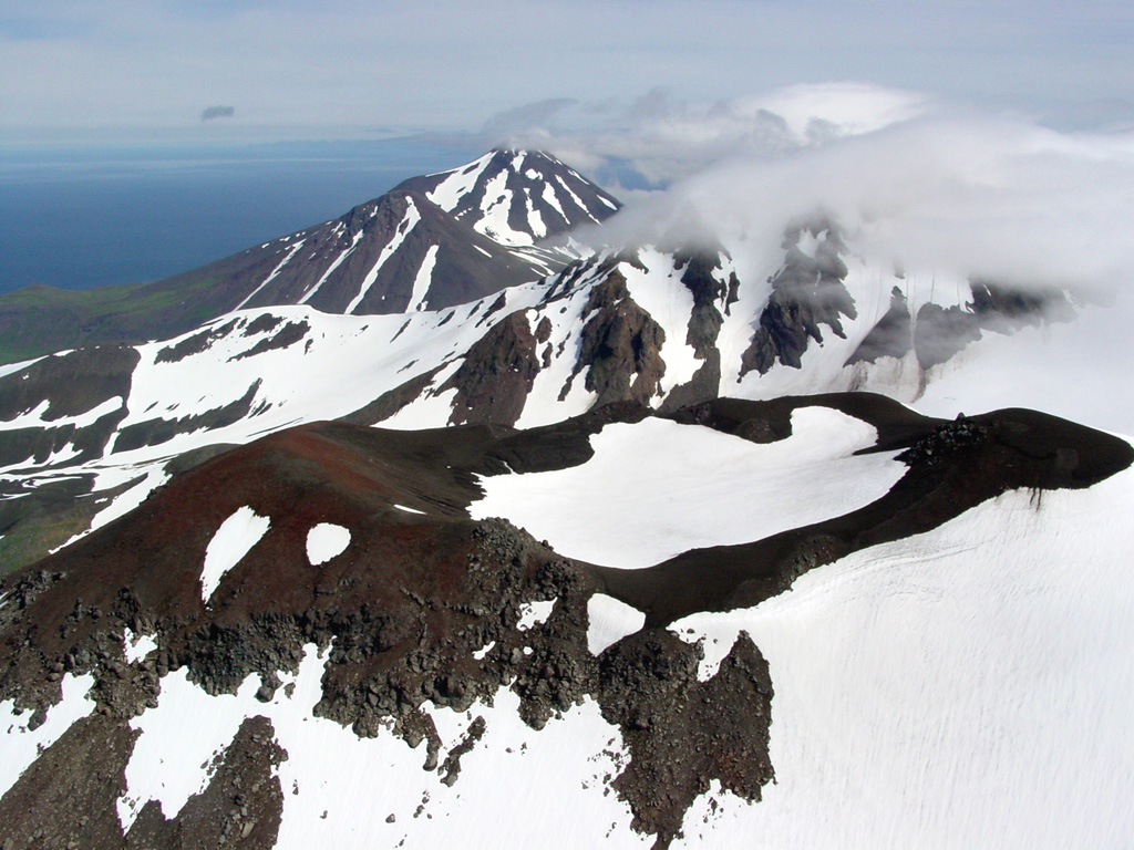An aerial view from the WNW shows a young vent on the NE side of Kluichef, which was constructed within the Pleistocene Atka caldera. Photo by Game McGimsey, 2004 (Alaska Volcano Observatory, U.S. Geological Survey).