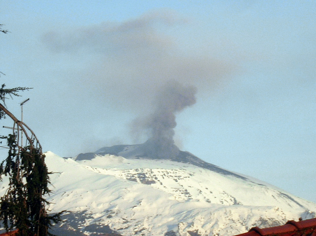 An ash plume rises about 1 km above the active vent on the eastern slope of Etna's Southeast Crater on the morning of 10 January 2008. The view is from Trecastagni, about 16 km SSE of the active vent. Summit vent eruptive activity began with a minor explosive eruption from Bocca Nuova on 19 March 2007. On 29 April activity began at Southeast Crater and flank vents produced lava flows. Intermittent explosive and effusive eruptions from Southeast Crater continued into 2008. Photo courtesy of INGV-Catania, 2007.