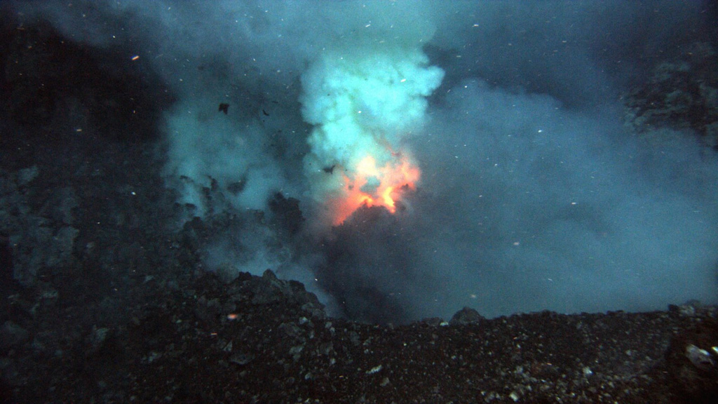 An eruption plumes rises from the Prometheus vent at West Mata submarine volcano summit in May 2009. A November 2008 NOAA Vents Program expedition to the Lau Basin had discovered hydrothermal plumes from an actively erupting site on the summit of West Mata volcano. During a return trip in May 2009 explosive and effusive activity was observed from Hades, a vent on the SW flank, and explosive activity ejecting ash and bombs was seen from a scoria cone at the Prometheus vent. Courtesy of NSF and NOAA Ocean Exploration Program, 2009.
