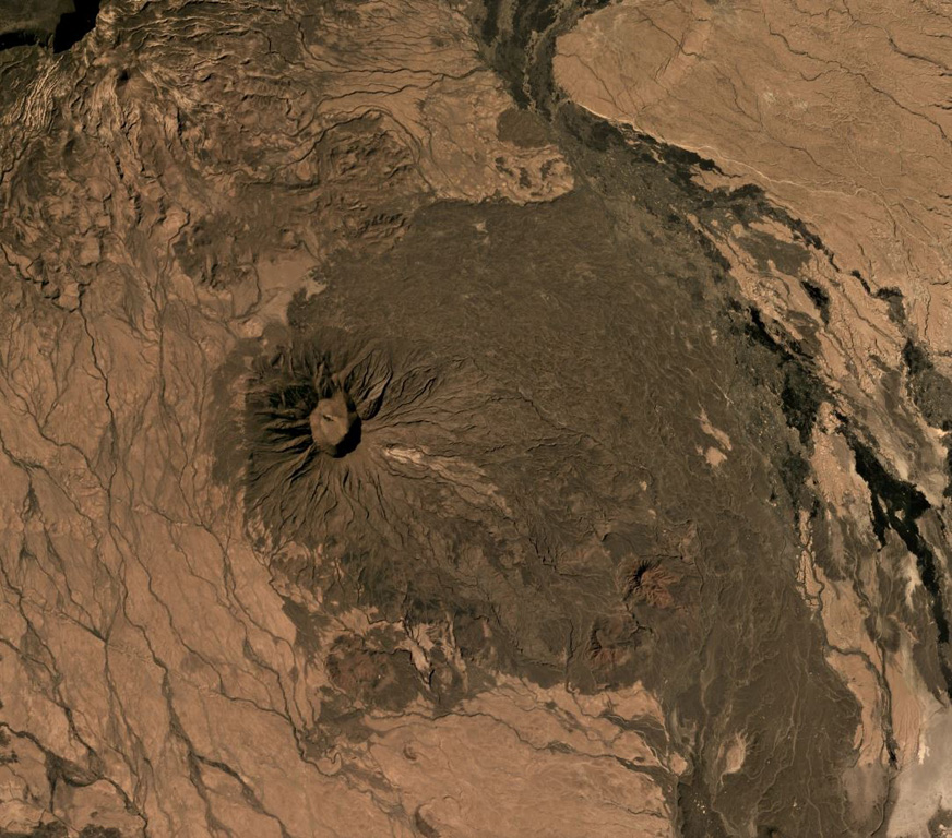Sork Ale is part of the Nabro Volcanic Range between the Danakil Depression and the Red Sea. The 1,100 x 1,200 m, 300-m-deep crater is near the center of this December 2019 Planet Labs satellite image mosaic (N is at the top). Darker eroded lava flows form the flanks and the lighter areas to the NE and SW are ignimbrite deposits from large explosive eruptions. Satellite image courtesy of Planet Labs Inc., 2019 (https://www.planet.com/).