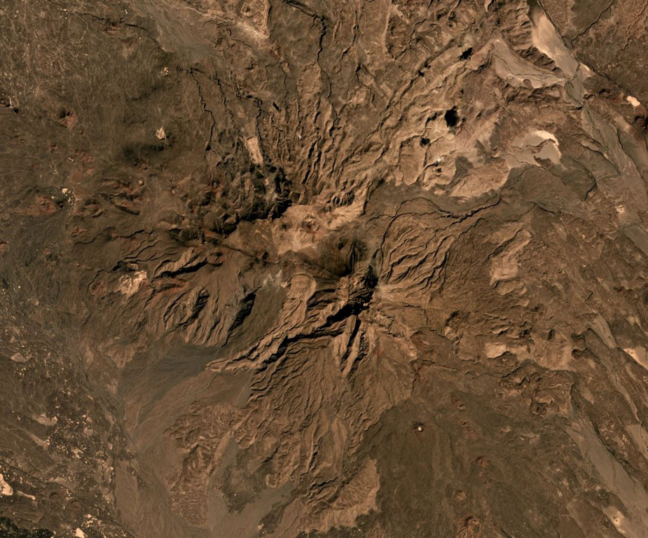Mousa Alli is located on the border of Ethiopia, Eritrea, and Djibouti, and is seen here in this December 2019 Planet Labs satellite image mosaic (N is at the top; this image is approximately 21 km across). The main edifice in the center has undergone extensive erosion and there are scoria cones and lava flows on the SE and NW flanks. Satellite image courtesy of Planet Labs Inc., 2019 (https://www.planet.com/).