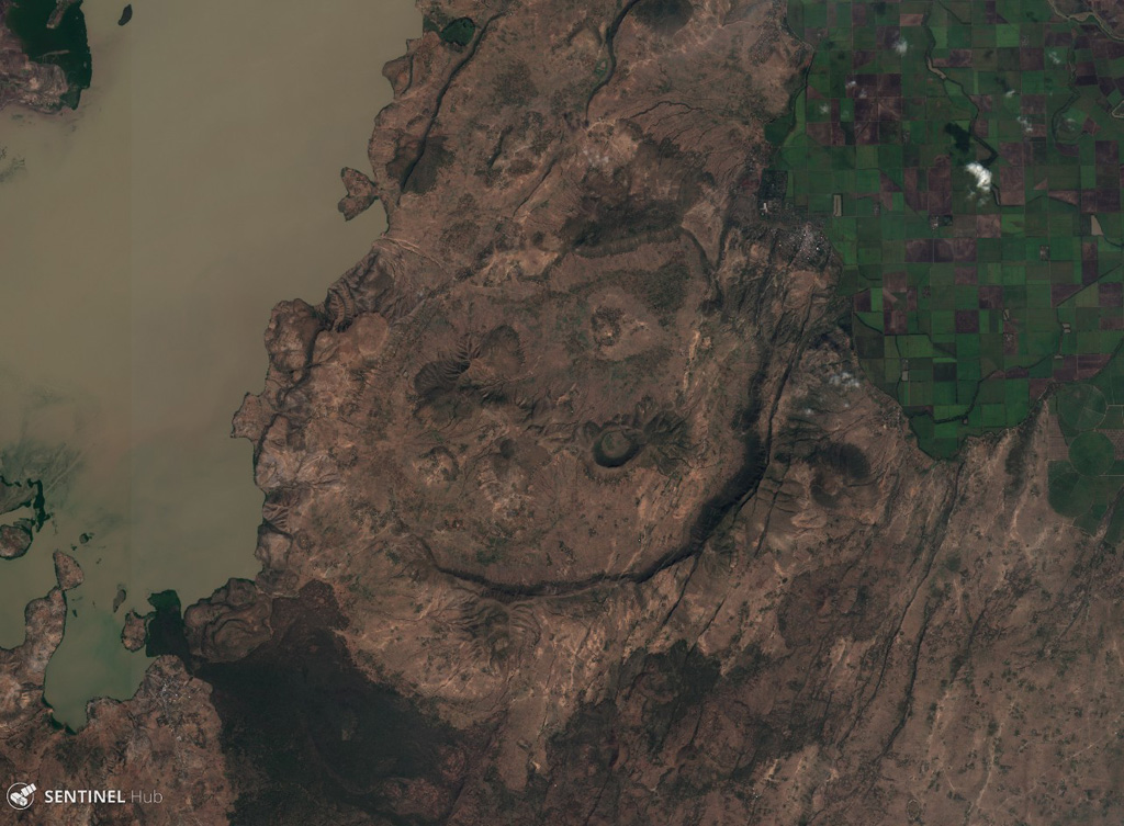 The 7 x 9 km Gedemsa caldera is located along the Main Ethiopian Rift, east of Koka Lake (left), seen in this 5 December 2019 Sentinel-2 satellite image (N is at the top). The caldera has produced ignimbrites, pyroclastic surge, ashfall, and has constructed scoria cones, with a 1-km-wide crater in the eastern portion. A younger lava dome and flow are on the SW flank. Satellite image courtesy of Copernicus Sentinel Data, 2019.