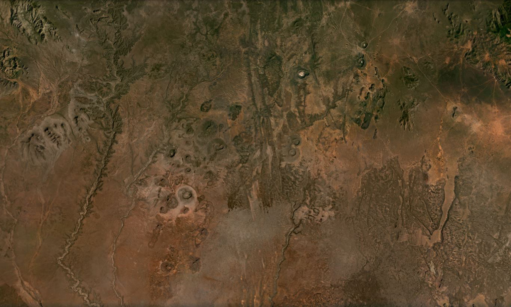 Cones, maars, lava flows, and craters of the Dilo-Dukana Field are visible in this December 2020 Planet Labs satellite image mosaic (N at the top; this image is approximately 104 km across) along the Ethiopia-Kenya border, which crosses roughly NW-SE through the view. The most prominent feature in the southern part of the field is the 1.8-km-wide Gof Dukana maar in Kenya, just SW of the center of the image. Satellite image courtesy of Planet Labs Inc., 2020 (https://www.planet.com/).