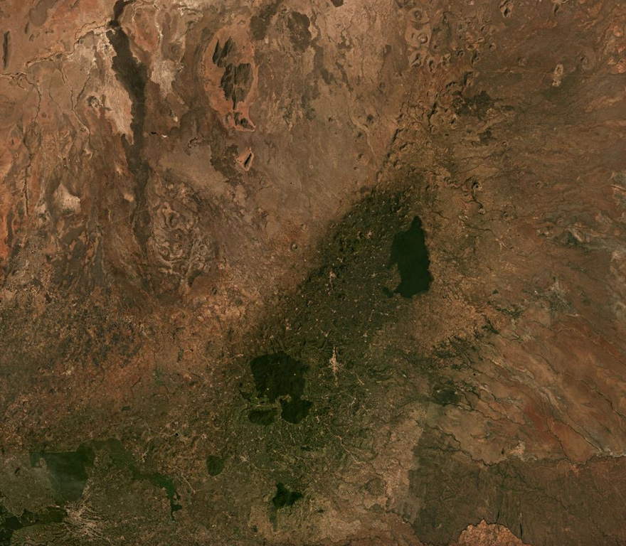 The broad NE-SW-trending Nyambeni Hills volcanic field is seen across this February 2019 Planet Labs satellite image mosaic (N is at the top; this image is approximately 80 km across). The field contains numerous scoria cones, craters, and lava flows across an area approximately 50 km in length, with the youngest features near the center. Satellite image courtesy of Planet Labs Inc., 2019 (https://www.planet.com/).