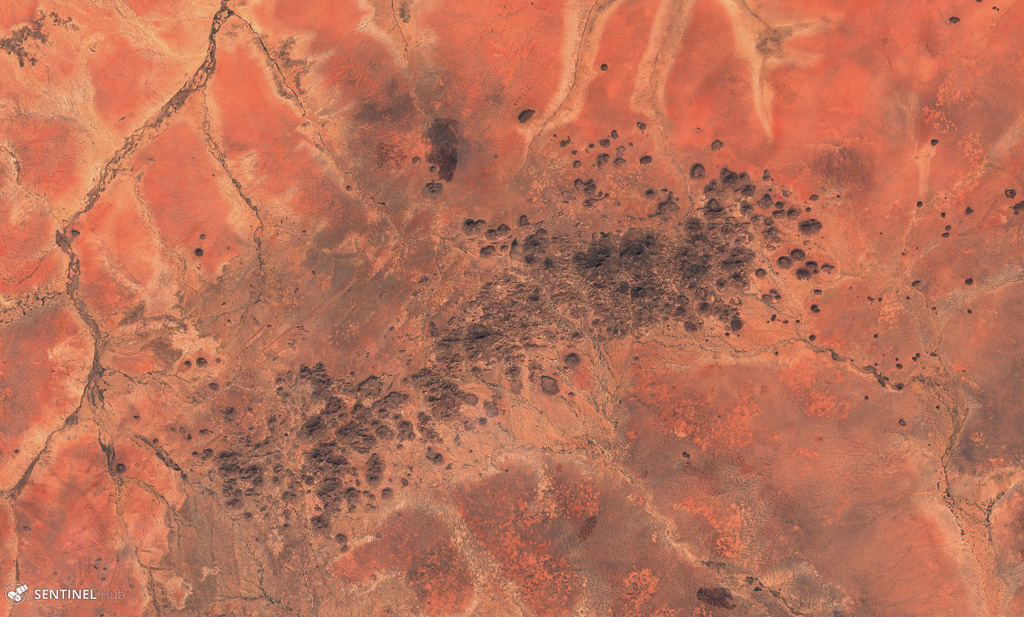 The Kutum Volcanic Field contains many scoria cones, craters, and lava flows, seen in this 25 November 2019 Sentinel-2 satellite image (N is at the top). This image is approximately 85 km across, and is south of the larger Meidob volcanic field. Satellite image courtesy of Copernicus Sentinel Data, 2019.