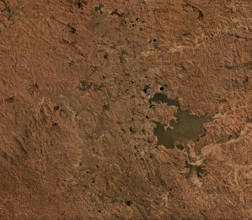 The Itasy Volcanic Field is a monogenetic field in central Madagascar around Lake Itasy near the center of this September 2019 Planet Labs satellite image mosaic (N at the top). The field contains scoria cones, lava domes, lava flows, and maars across an area of 1,600 km2. There have been 131 scoria cones identified throughout the field. Satellite image courtesy of Planet Labs Inc., 2019 (https://www.planet.com/).