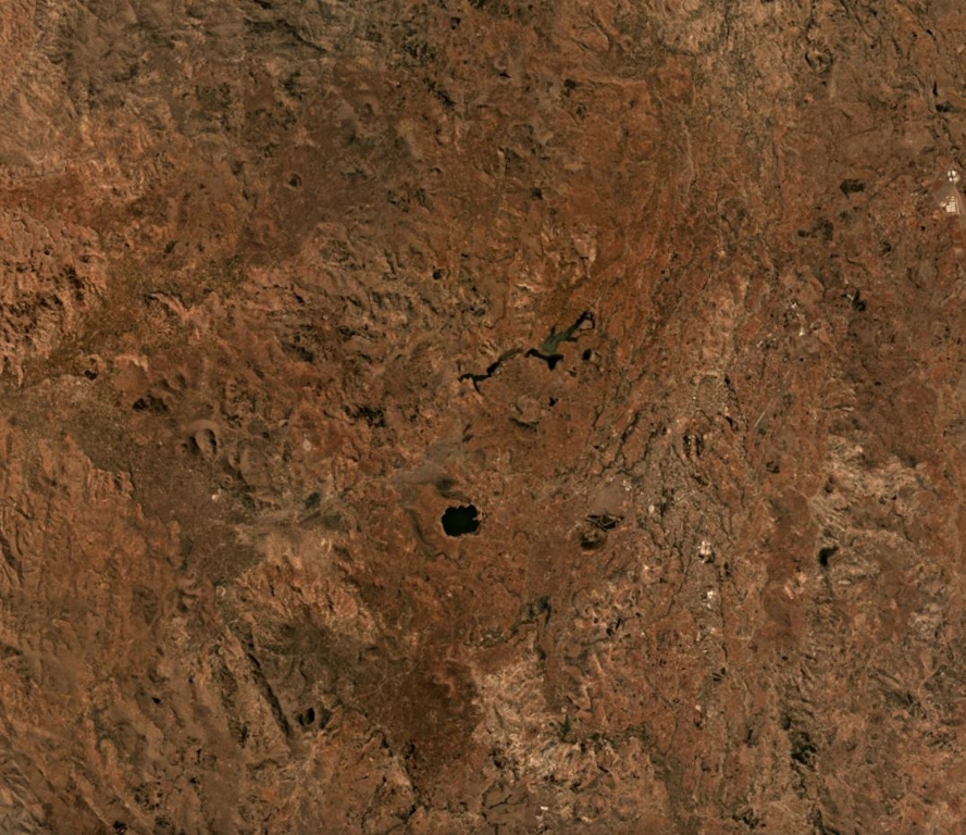 The Vakinankaratra volcanic field covers an area of 3,800 km2 in central Madagascar, some of which is shown in this September 2019 Planet Labs satellite image mosaic (N is at the top). The field contains monogenetic scoria cones, lava flows, lava domes, and maars. Satellite image courtesy of Planet Labs Inc., 2019 (https://www.planet.com/).