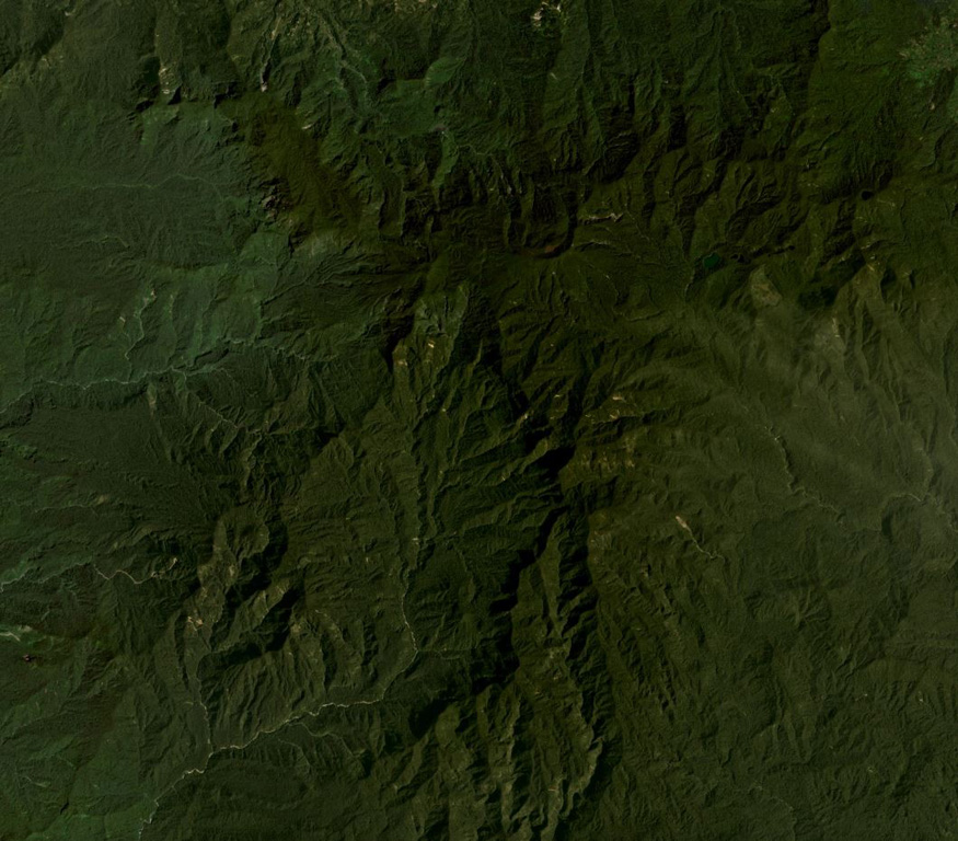 Crater Mountain is located in the Eastern Highlands Province of Papua New Guinea, seen here in this December 2019 Planet Labs satellite image mosaic (N is at the top). The field is an arcuate chain of eroded peaks containing two craters over 1 km wide and around 30 smaller identified vents. Satellite image courtesy of Planet Labs Inc., 2019 (https://www.planet.com/).